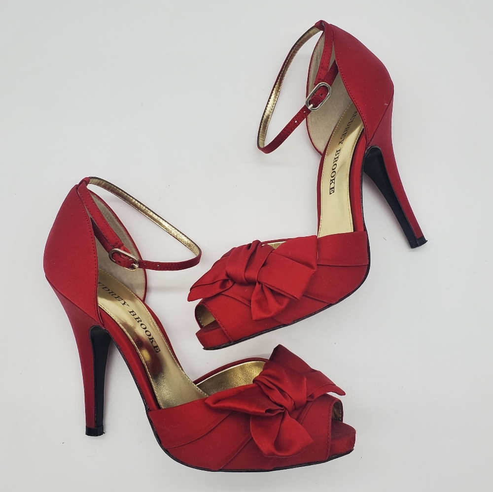 Red satin heels with bows